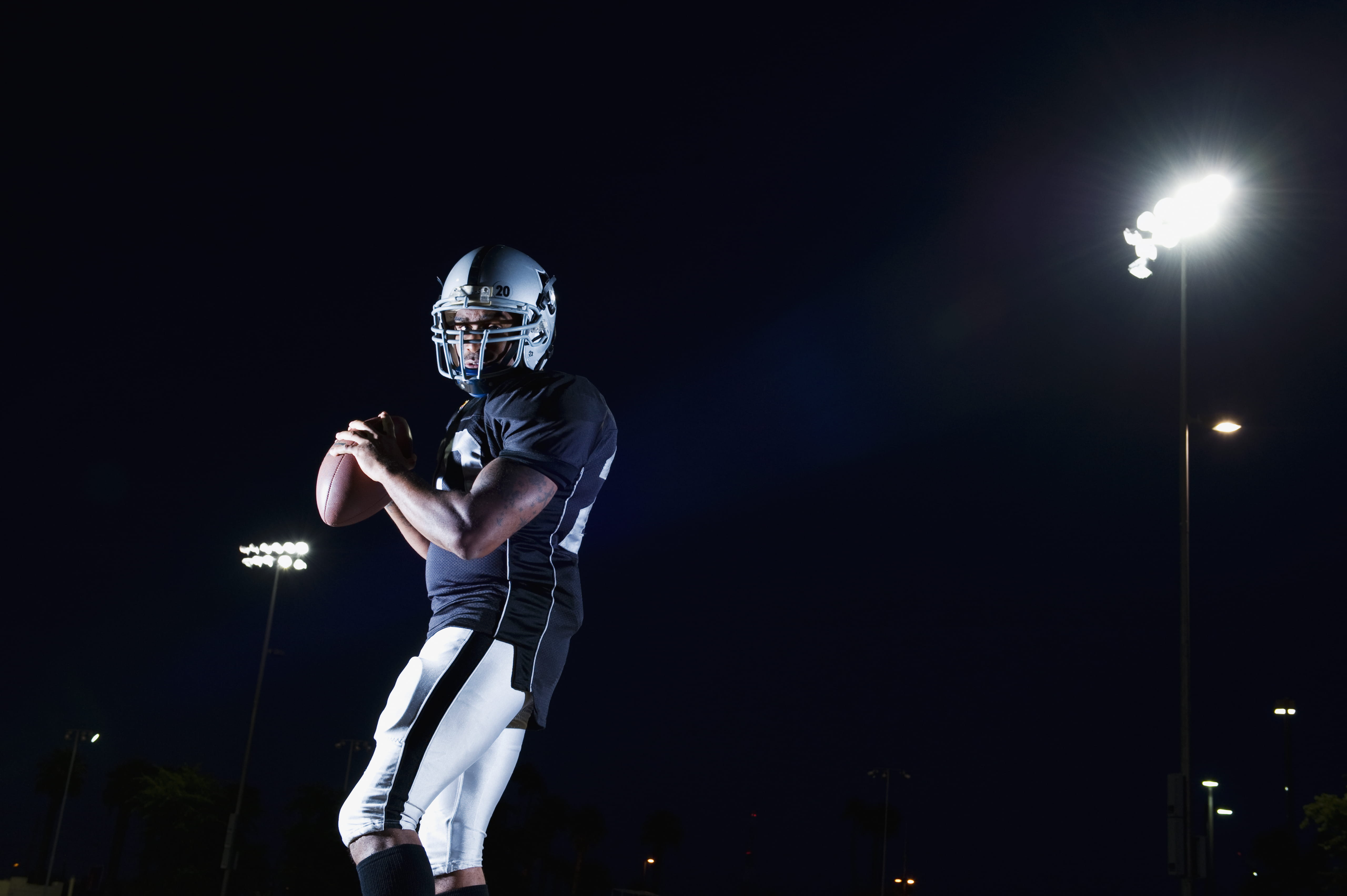 Football player catching a football